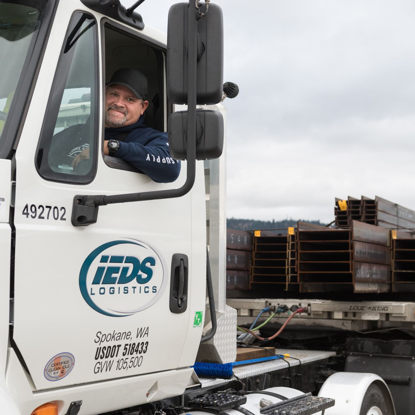Truck driver waiting to deliver goods.